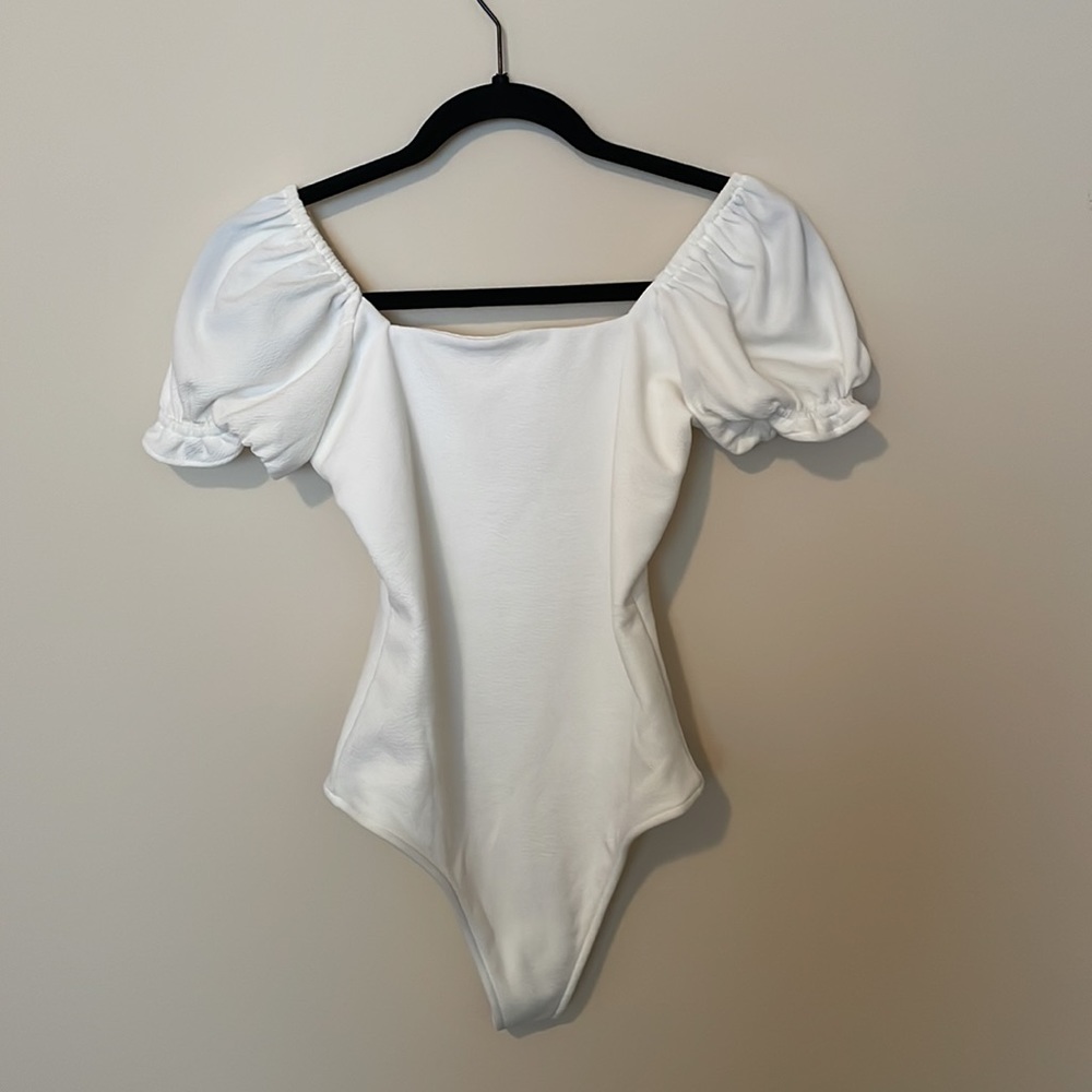 Small, white bodysuit from Show Me Your Mumu.